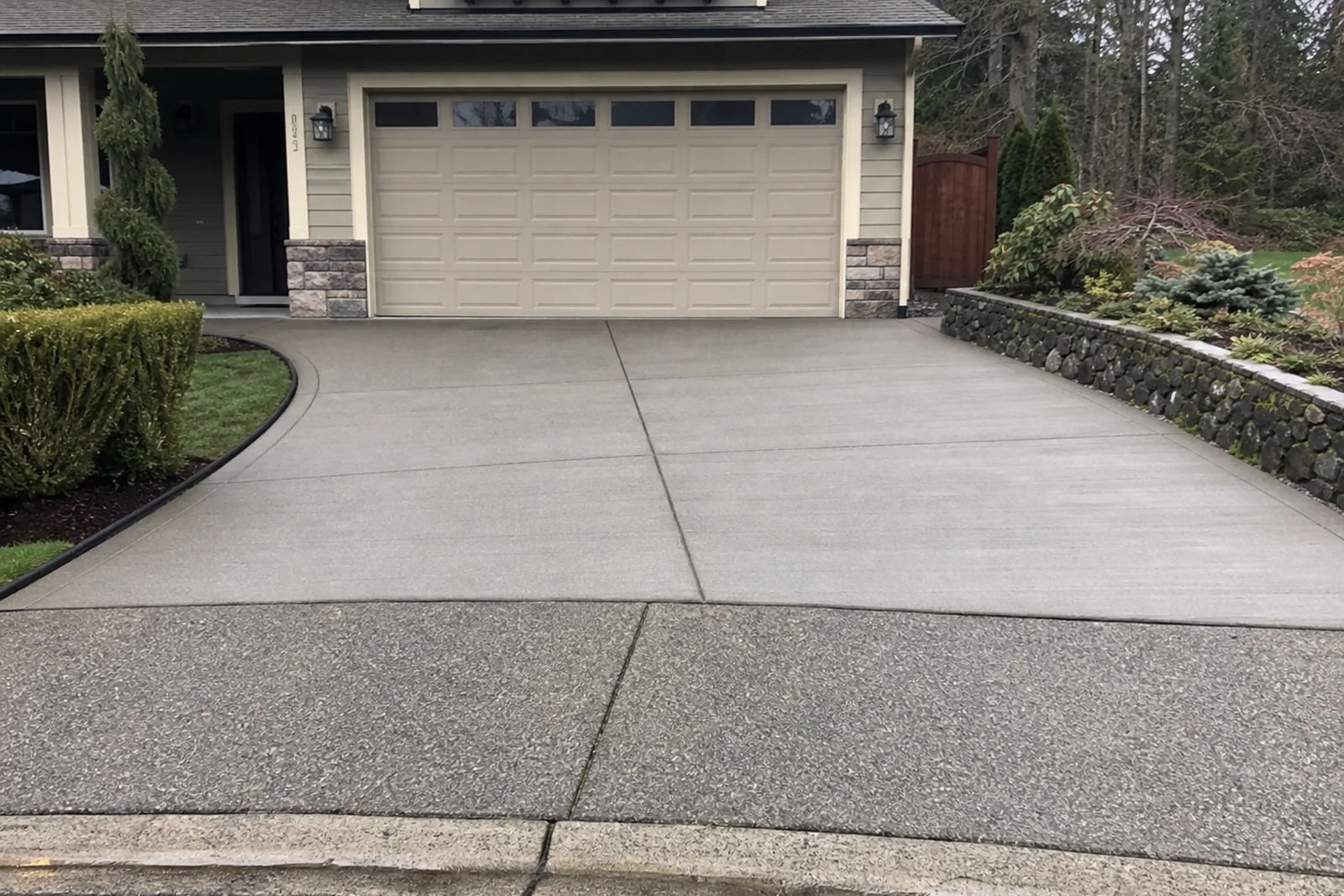 Concrete driveway installation Redmond Washington King County Pacific Northwest drainage pitch Eastside residential Kevin